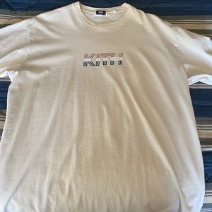 Men’s beige Kith T-shirt. Size large